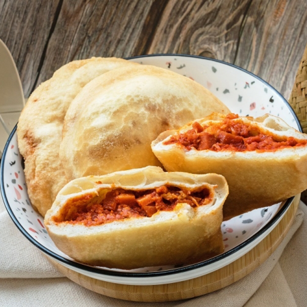 Máquina de empanadillas y productos rellenos