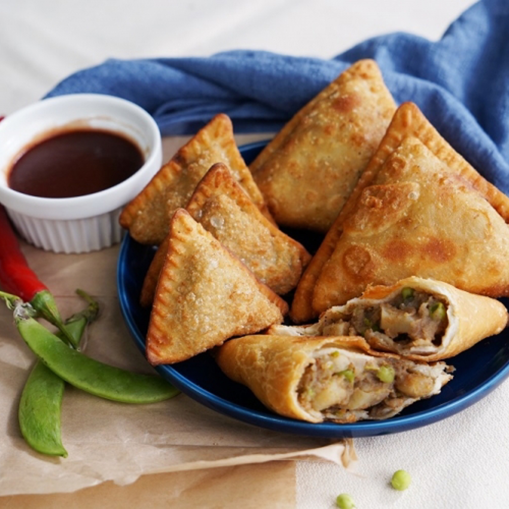 Máquina de empanadillas y productos rellenos